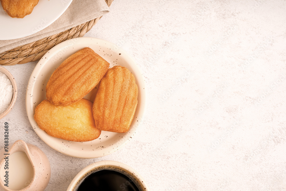 Wall mural Composition with delicious Madeleine cookies on light background