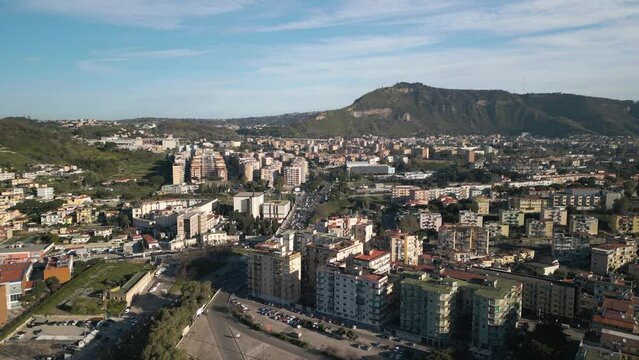 Drone Flying Away from Fuorigrotta Suburb in Napoli, Italy. Apartment Buildings, Mountain Landscape