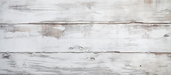 Chipped and cracked white paint on a wooden wall, revealing the natural texture underneath