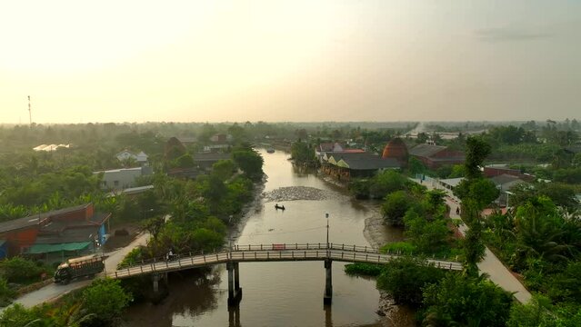 Brick kilns and pottery kilns growing close together, from a distance, look like flaming towers under the sun, in Mang Thit, Vinh Long province, Viet Nam