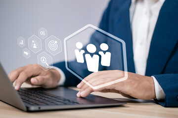 HR management concept. Recruitment, Employment, Headhunting, Team building. Businessman using laptop with human resources  icon on virtual screen.