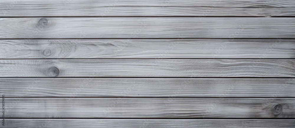 Poster a closeup of a rectangular grey wooden surface with parallel siding, featuring tints and shades of g