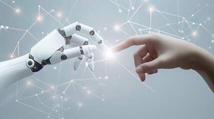Harmonious Coexistence: Human and Robot Fingers Touch in Delicate Interaction on a light gray background studded with glowing particles - 768399073