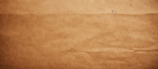 A close-up view of a single piece of brown paper displaying a torn edge, creating a textured and rustic appearance