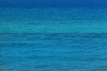 close up of blue sea water surface natural background 