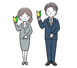 初心者マークを持つスーツの女性と男性