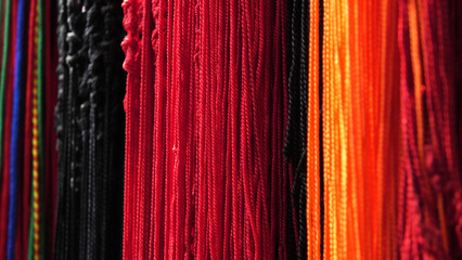 In a shop selling colorful thread strings used for spiritual purposes