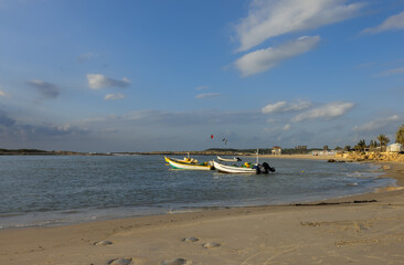 seascape with boats on Hof Dor at sunset in Israel