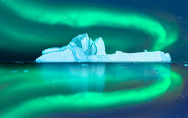 Iceberg floating in greenland fjord  
with aurora borealis - Greenland