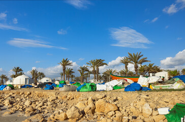 bags with fishing nets on the seashore