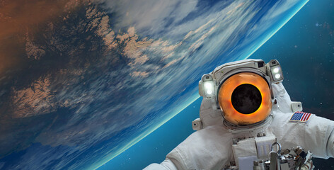 An astronaut watching the Solar Eclipse in space "Elements of this image furnished by NASA"