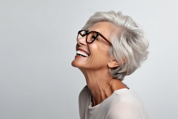 Happy senior woman in eyeglasses. Portrait of beautiful middle aged woman in eyeglasses.