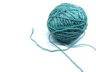 Turquoise blue knitting thread isolated on white