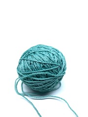 Turquoise blue knitting thread isolated on white