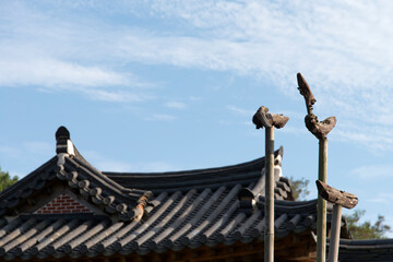 Blue sky on the tiled roof in the traditional Korean building