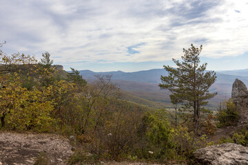 Walking in the highlands at the beginning of the autumn season, ,mountain panorama, nature in anticipation of autumn, cloudy day