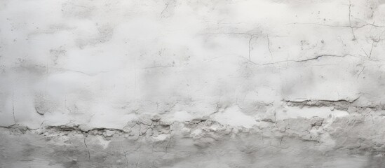 A closeup photo of a white wall filled with numerous holes, resembling a snowy landscape in...