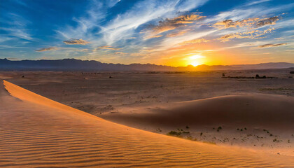 Fototapeta na wymiar 夕暮れの砂漠。広大な砂漠地帯の夕焼け。Desert at dusk. Sunset over a vast desert area.