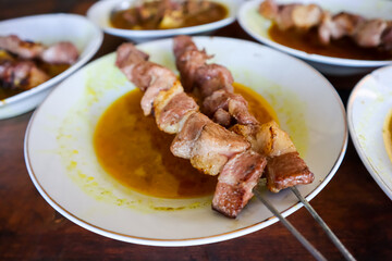 Sate Klathak, an uniq young goat or mutton satay dish with steel skewers that served with curry soup. Originally from Yogyakarta, Indonesia