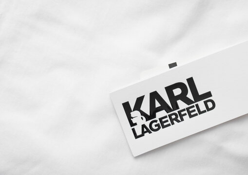 LONDON, UK - FEBRUARY 15, 2024: Karl Lagerfeld logo tag on premium white fabric t-shirt.Macro.