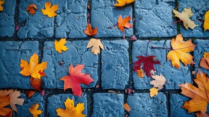 Beautiful autumn leaves lie on the paving stones. Natural background Fallen autumn leaves