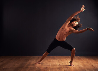 Dancer, performance and man in studio for creative, movement and rhythm on floor. African male...