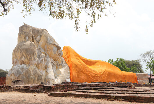 Large white reclining Buddha statue at Wat Lokayasutharam or Wat Phra Non in Ayutthaya Historical Park, Thailand