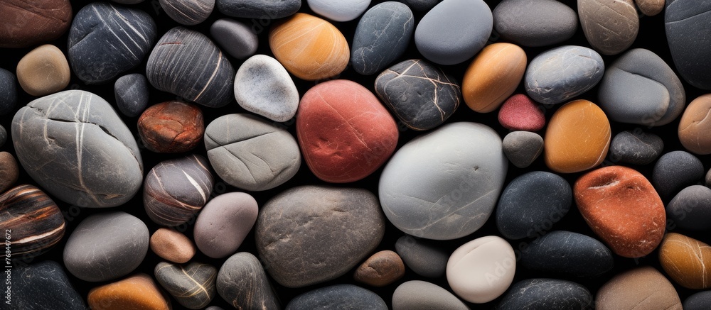 Poster An up-close view of a collection of rocks with one distinctive red stone among them, forming a unique contrast