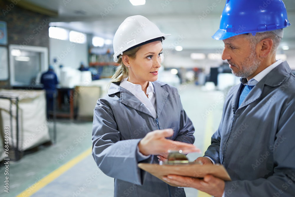 Poster man, woman and conversation with clipboard in warehouse for quality inspection or safety checks and 