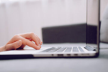Close up of woman hand typing on laptop computer keyboard and surfing internet, online, working, business and technology, internet network communication concept