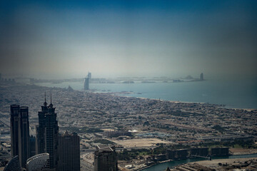 Dubai,  Unite dArab Emirates - October 19, 2019 - A hazy aerial view of a city with skyscrapers and...