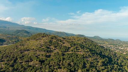 Nicolosi, Sicily, Italy. Volcanic craters overgrown with forest on the slopes of Mount Etna, Aerial View