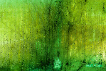 wet green glass. condensate droplets
