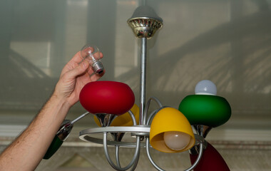 replacement of the lamp in the lamp. concept