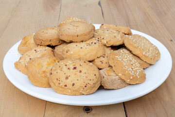 Mix bakery biscuits on a wooden table closeup