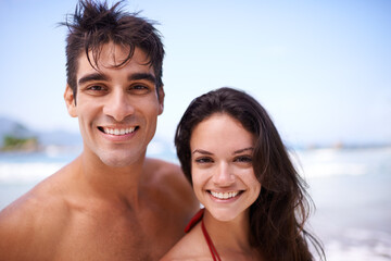 Fototapeta premium Happy, beach and portrait of couple on vacation, adventure or holiday for romantic travel. Smile, love and young man and woman on date by ocean or sea for tropical outdoor anniversary weekend trip.