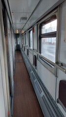 Obraz premium Railway carriage corridor with brake valve handle