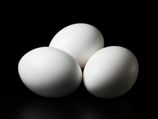 Three White Eggs Isolated on Black Background. Generative AI