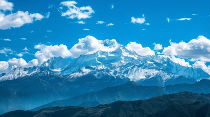 Majestic snowy peaks pierce a clear blue sky in this breathtaking mountain landscape - Powered by Adobe