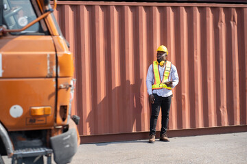 African logistic engineer man worker or foreman working with container at container site	 - 768518676