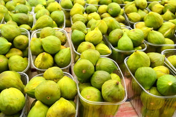 Pile of fresh organic limes at local farmers market