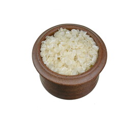 flattened rice flakes isolated on white.