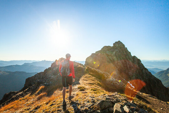 Backpacker approaches the summit of Tomyhoi Peak in Washington.