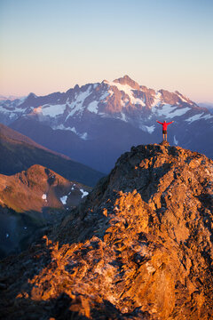 Hiker reaches summit in North Cascades National Park.