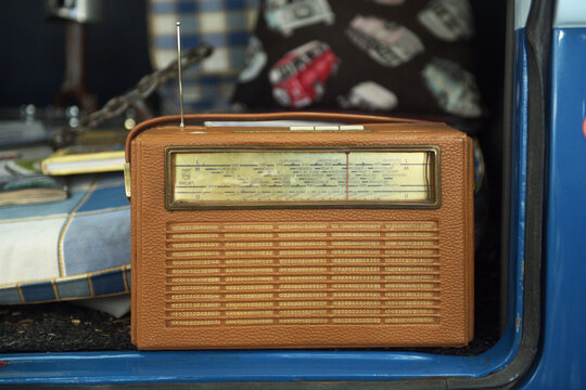Vintage Philips radio in the trunk of a car.