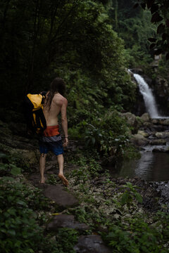 Man traveler in the tropical jungle of Indonesia. Bali