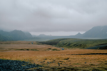 South Iceland moody travel landscape with field grass farmland