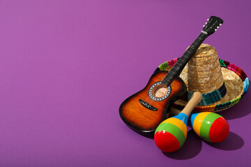 Mexican sombrero with decorative guitar and maracas