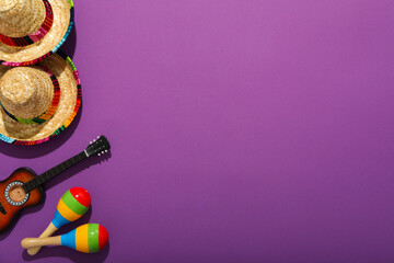 Mexican sombrero with decorative guitar and maracas