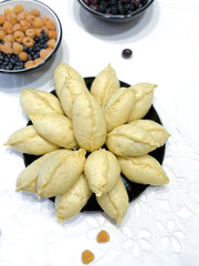 Plate of food with blueberries, essential ingredient in background